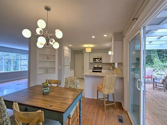 Dining room, kitchen and living room to the left