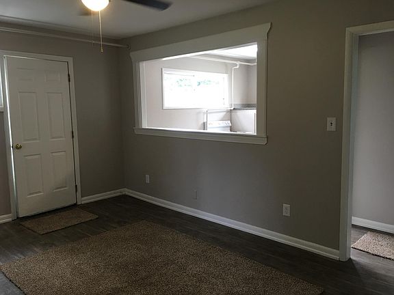 Living room with pass-through to kitchen.