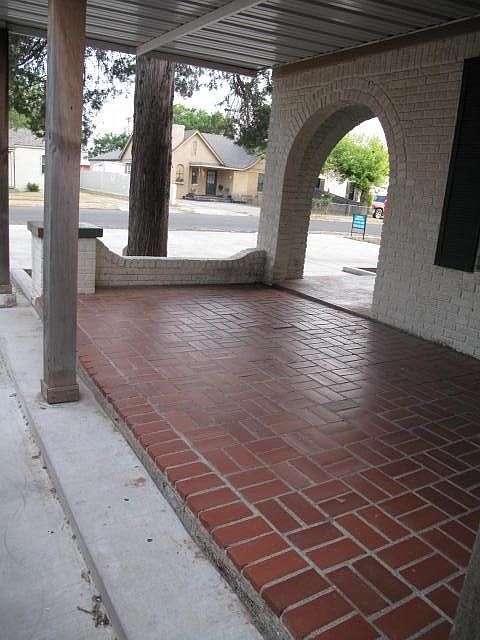 View from the covered front porch to the street and parking
