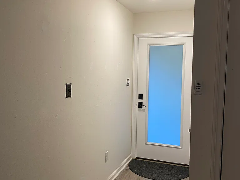 Front door _ frosted glass door, and coat closet (not shown)
