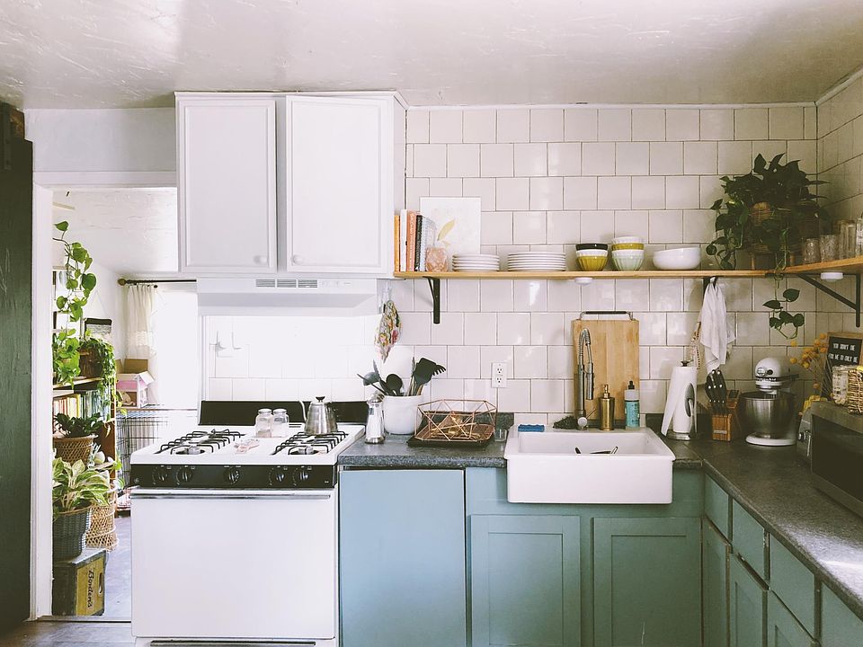 Kitchen with concealed dishwasher next to sink.