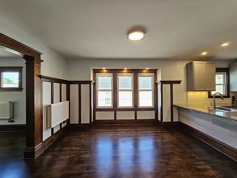 Unit has been renovated to provide an open concept design that allows sunshine to flow freely throughout the unit. Window shades are attached to living room window, bedroom windows, and dining room bay windows.