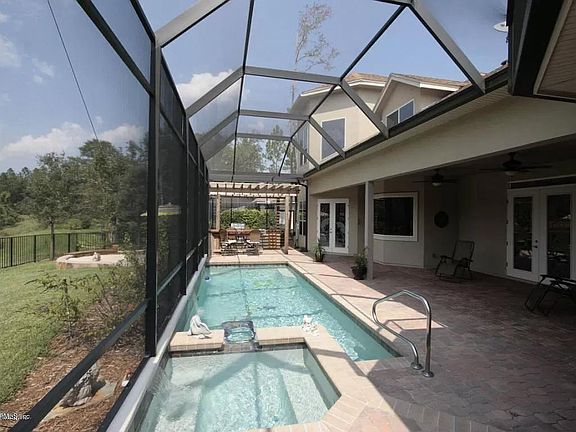Spa to Pool to Summer Kitchen view.