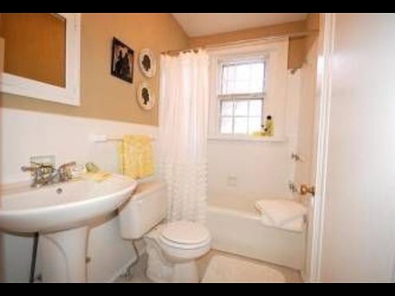 Photo taken from original home listing. Lovely storage vanit