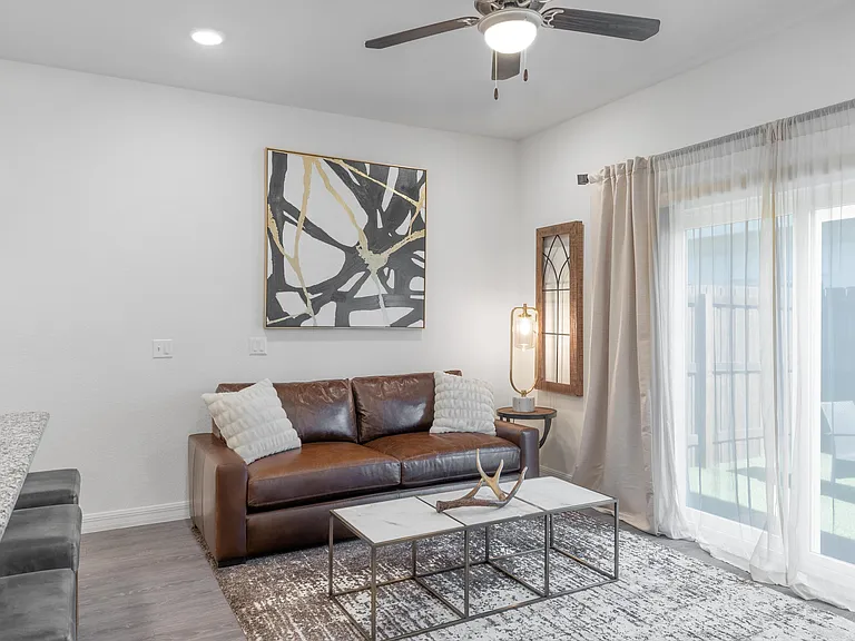 Experience a chic and inviting atmosphere in this beautifully designed living space.