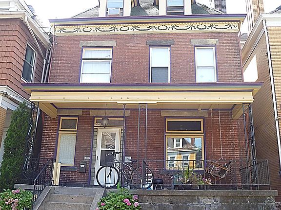 house faces east - porch swing included