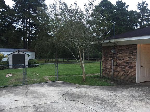 Fenced in backyard and shed