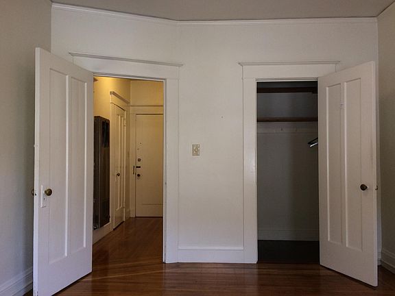 Bedroom closet and hallway to front door.