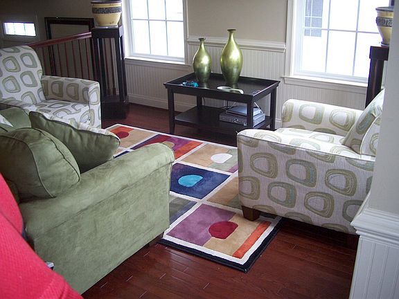 Sitting area with cherry hardwood floors