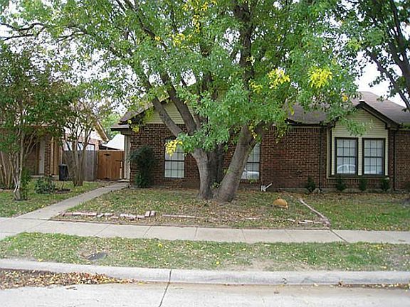 Front of home with beautiful crepe myrtle trees and shade trees