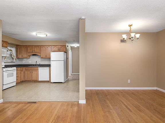 Nice hardwood flooring in dining/living room with an open floor plan.