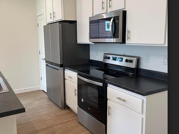 Kitchen including brand new appliances