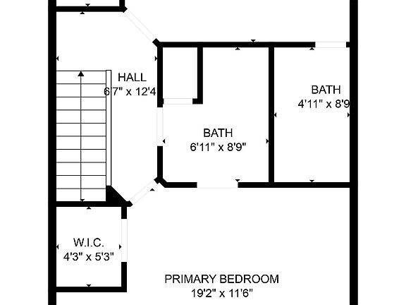 The primary bedroom has a small office nook. 
The rear bedroom, at the top of this image, has vaulted ceilings and two skylights.