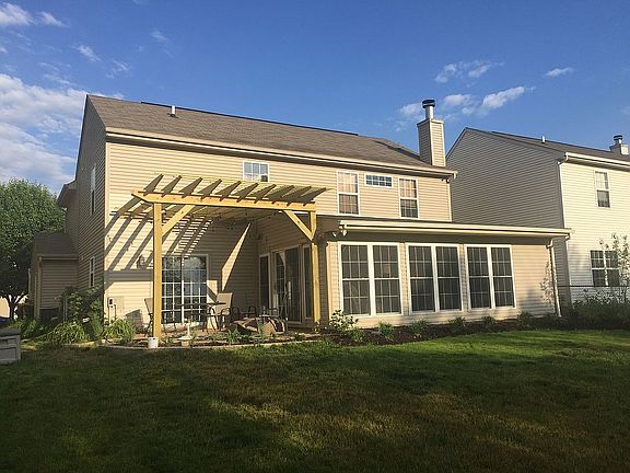 Rear of home with Pergola