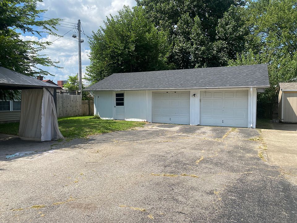 Large two car garage with additional workshop or craft room
