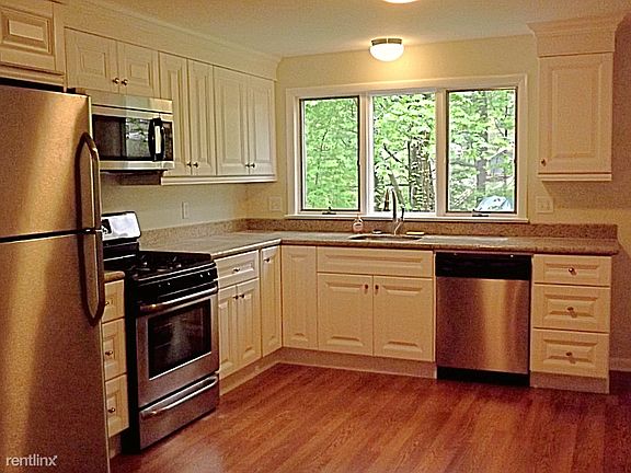 Kitchen with all new appliances (refrigerator, microwave, ov