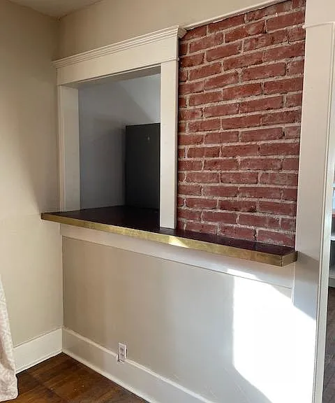 Rustic exposed brick with the open bar area