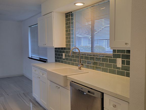 New Kitchen with soft close doors, full extension drawers, and quartz counters