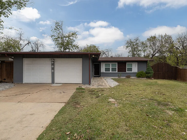 Charming single-story home with a clean, modern exterior, attached garage, and spacious front yard. Quiet neighborhood setting with plenty of parking and easy access to the front entrance.
