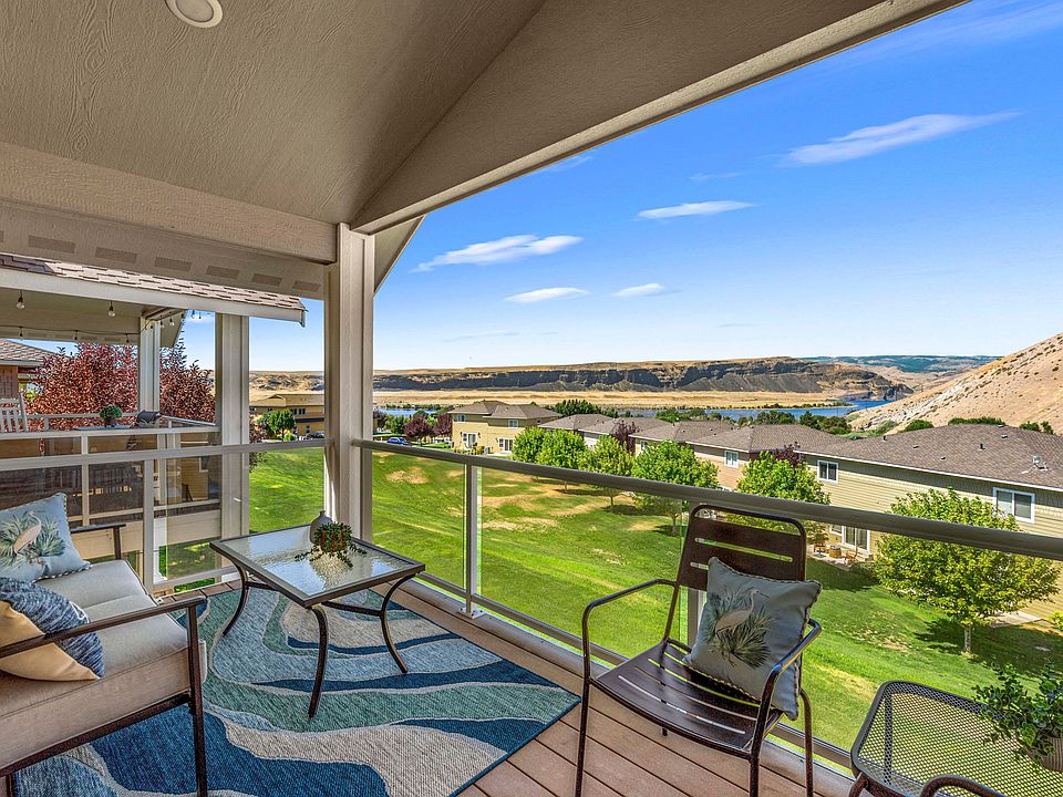 Covered patio with sweeping views - perfect for relaxing or entertaining year round