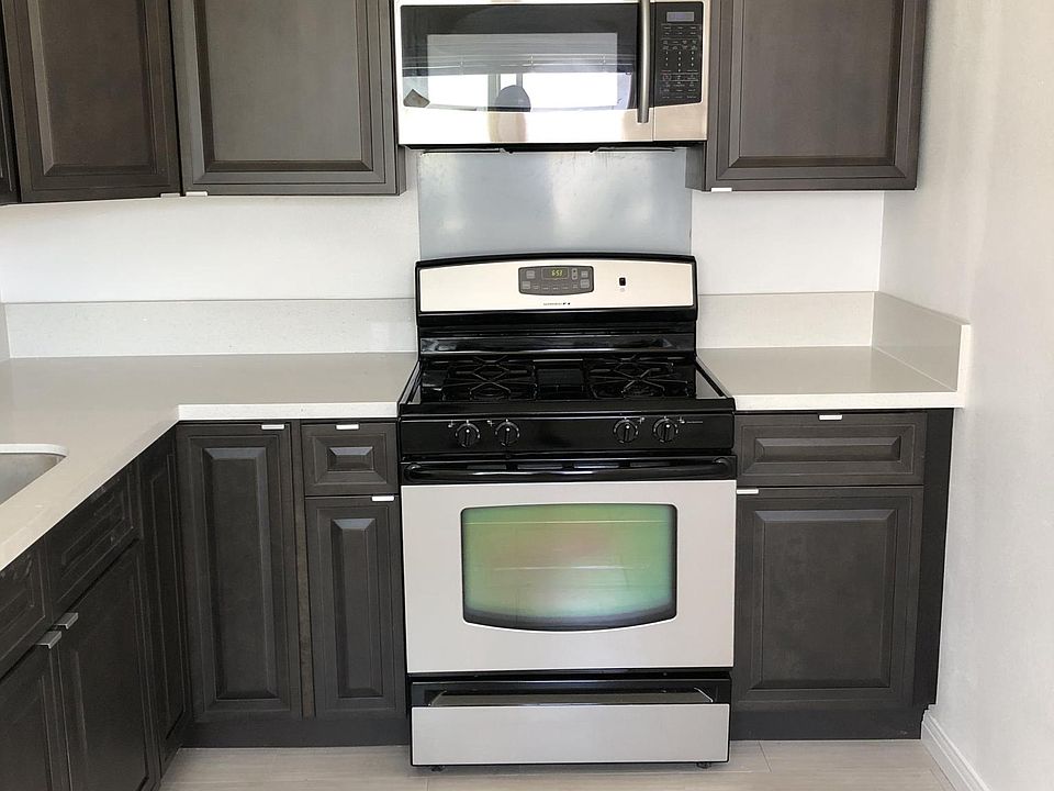 Stainless steel appliances and custom cabinets with quartz c