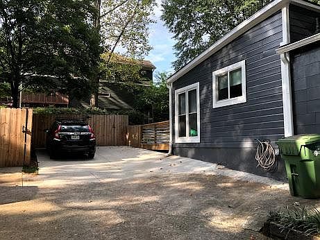 Two parking spaces within the shared driveway (secured behind the automated gate)