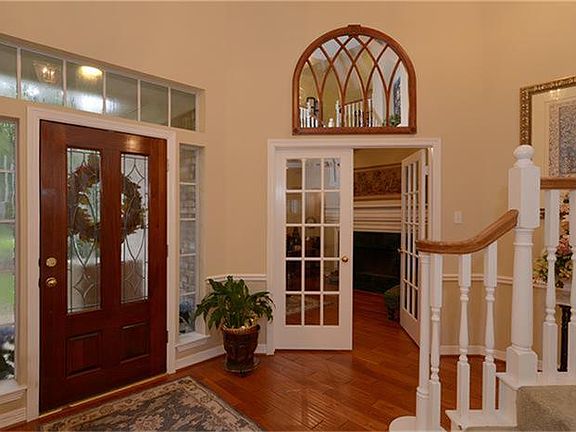 The beautiful hardwoods in the entry flow into the dining room and study also.