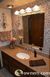 Main floor bath - glass tiled walls with ceramic tiled floor