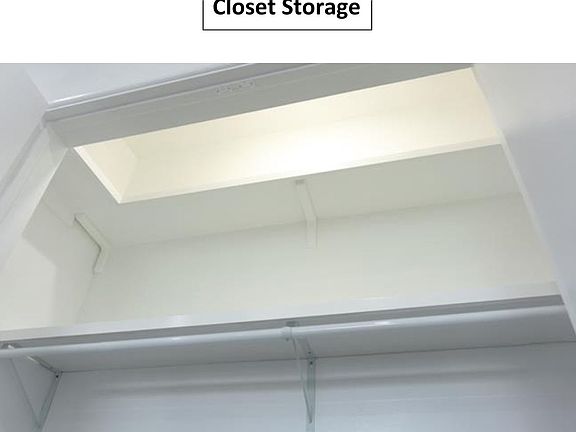 Closet with extra shelf and light
