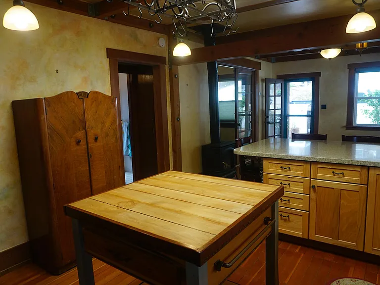 Kitchen looking to Bar, Livign room and Front Door