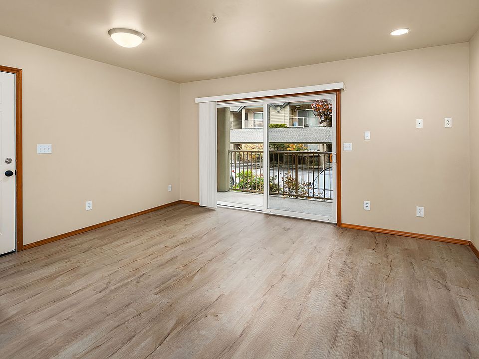 Living space with large sliding glass door providing tons of natural light