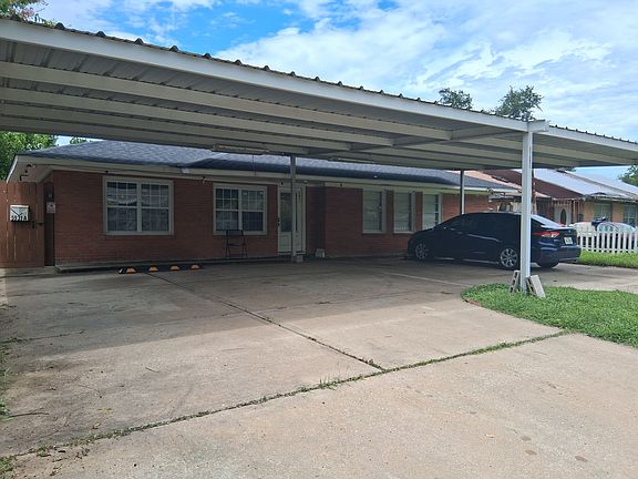 covered parking space, has a camera 24x7