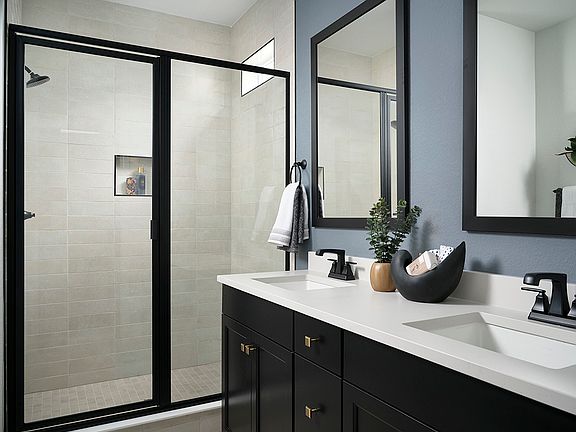 Example of Primary Bath Suite with Double Sinks, White Quartz Countertops and Black Cabinetry