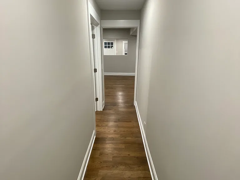 Looking down hallway towards kitchen. Bedroom is to the left and bathroom is at the end of hall next to where the picture was taken.