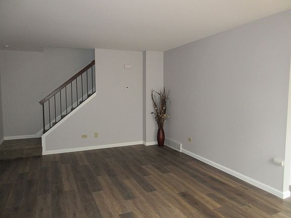 Walk into the large living room with the stairs (with new carpet!!) to the 2nd floor. The flooring h