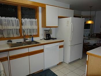 Another view of the kitchen to dinette.