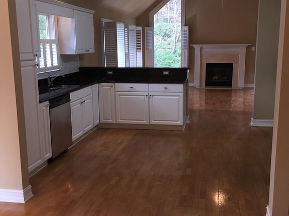Recently updated kitchen with black granite and stainless steel appliances