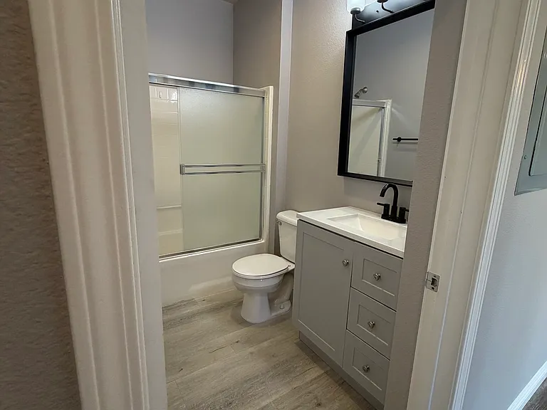 Beautifully remodeled guest bathroom with modern finishes.
