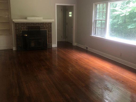 Loving room leading to walk in attic