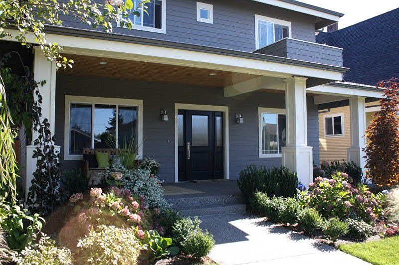 Covered aggregate front porch with tongue and groove ceiling. Also has wired for Christmas lights.