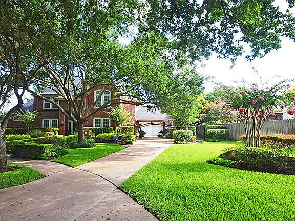 THE IDEAL CULDESAC LOCATION IS ENHANCED BY THE SPACIOUS SIDE YARD!