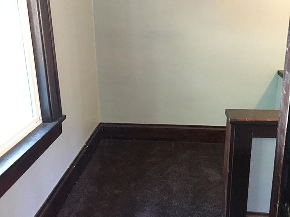 Sitting area outside front door to apartment.