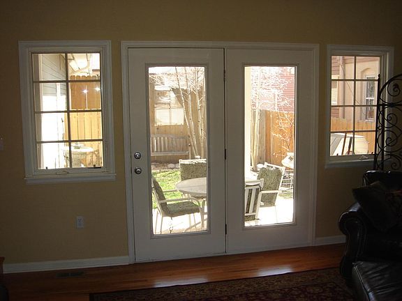 Living Room - Doors and windows open to patio.