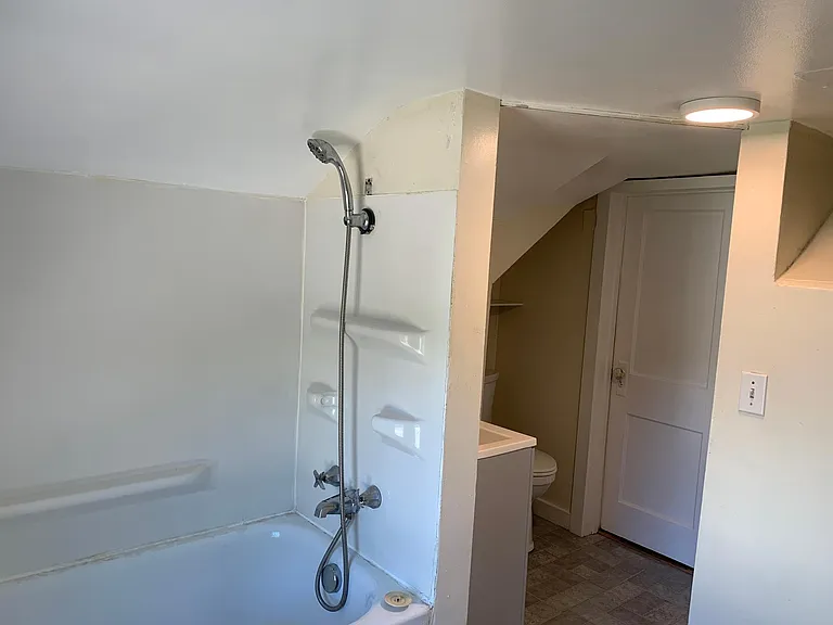 Bathroom has tub and shower