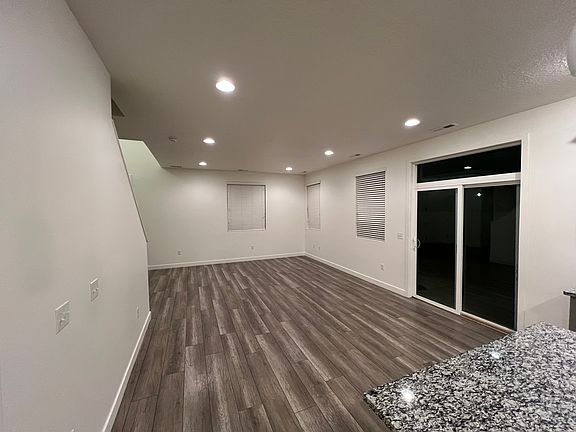 Living area space. Doors lead to patio and garden area.