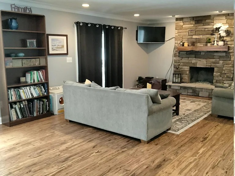 living room, hardwood flooring, gas fireplace