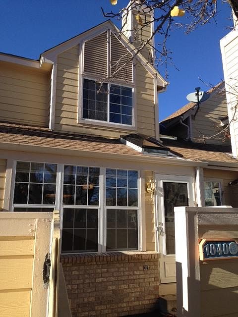 Sunny front patio. Big Windows facing South. Privacy trees provide seasonal shade and beautiful fall colors. Grassy park area in front yard.