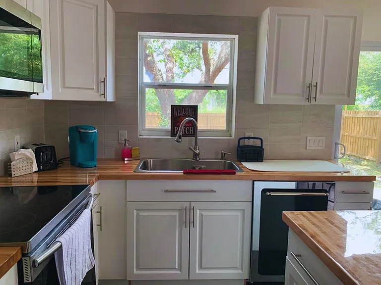 Bright Kitchen with Beautiful Views & Ample Storage.