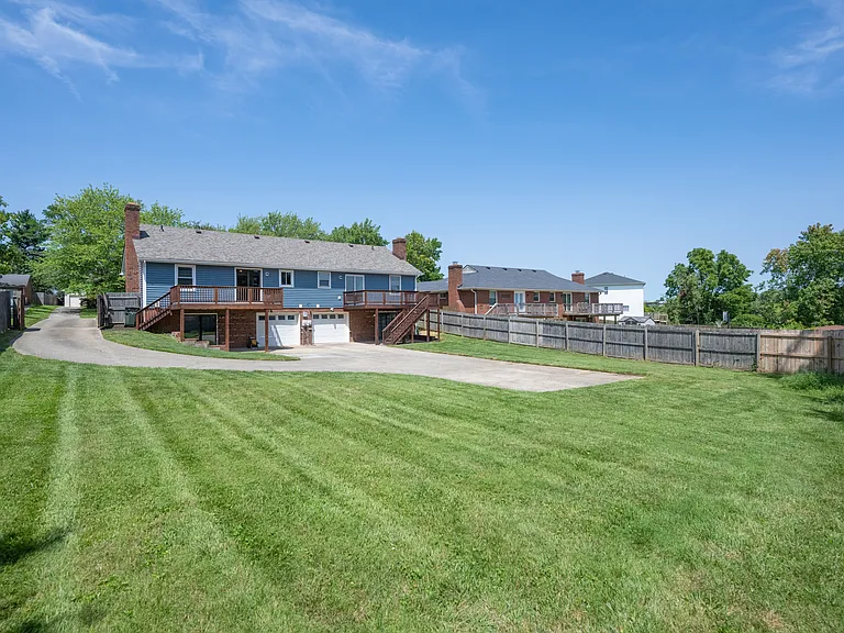Large yard with plenty of parking, and single car garage