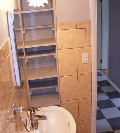 Bath with Linen Storage Shelves